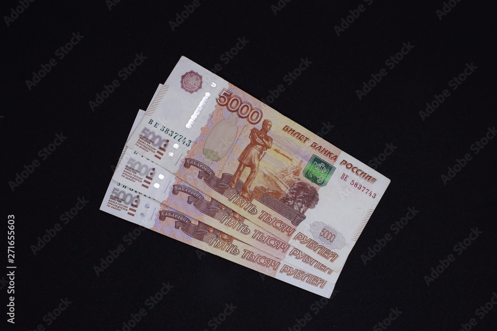 lots of Russian money. banknotes come in denominations of five thousand. banknotes close-up. lots of Russian money. banknotes come in denominations of five thousand. banknotes close-up.
