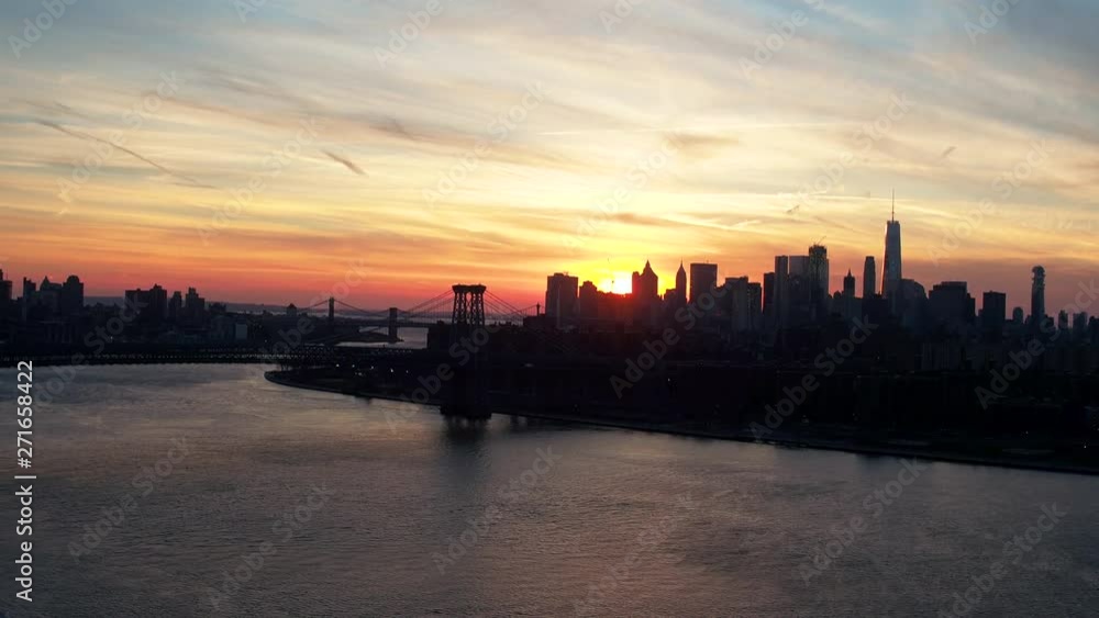 Wide aerial, sunset over New York City skyline Wide aerial, sunset over New York City skyline