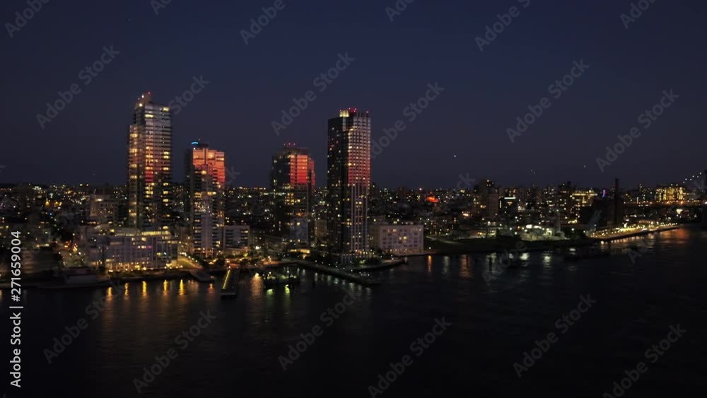 Illuminated New York City skyline, wide aerial Illuminated New York City skyline, wide aerial