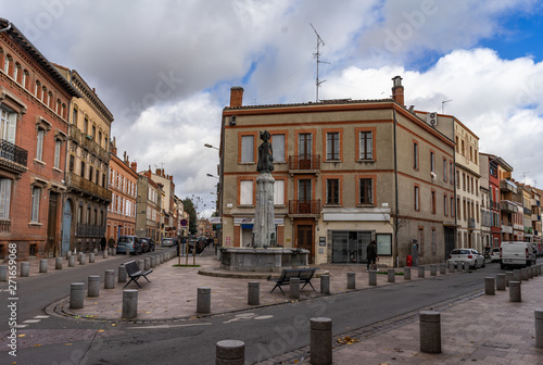 Square fountain on street in Toulouse, France.