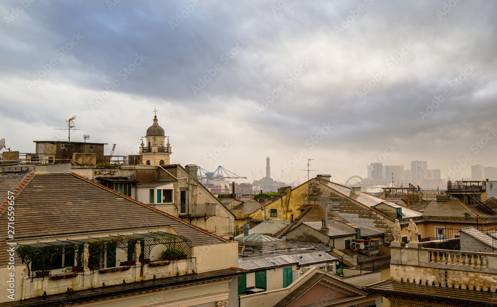 High angle view of the Genoa rooftops with the silhouette of the lighthouse (called 
