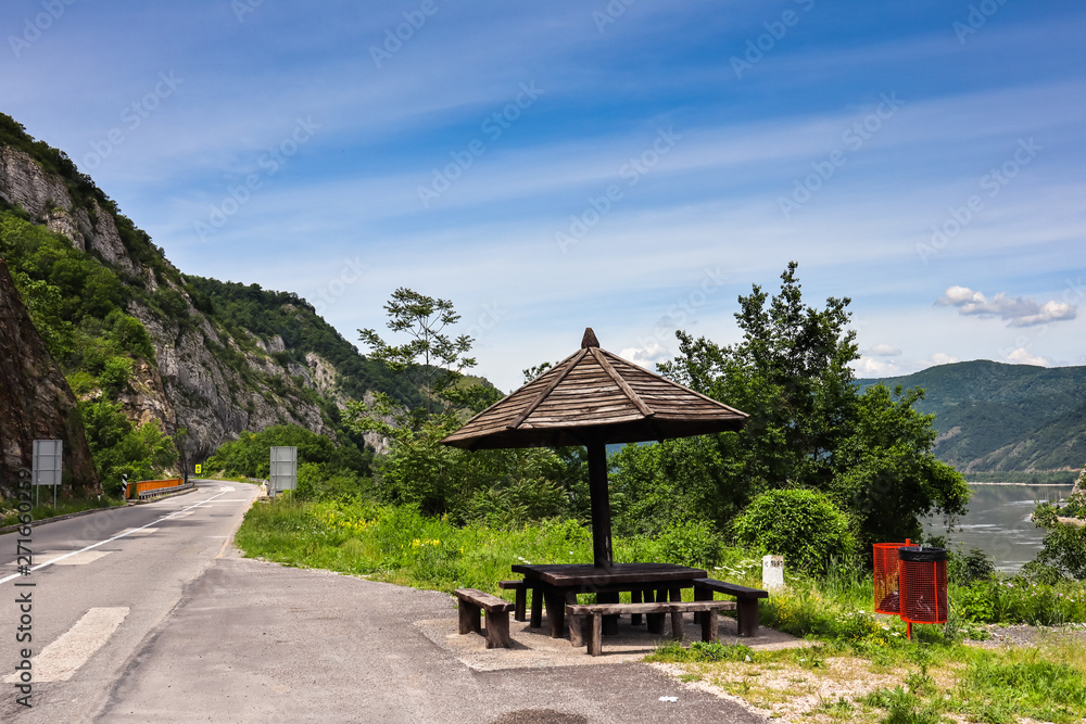 Public benches by the road in Djerdap gorge by the Danube river Public benches by the road in Djerdap gorge by the Danube river