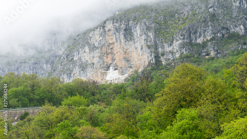 Ostrog Monastery beautiful view. The most holy place in Montenegro. Orthodox monastery inside rock mountain