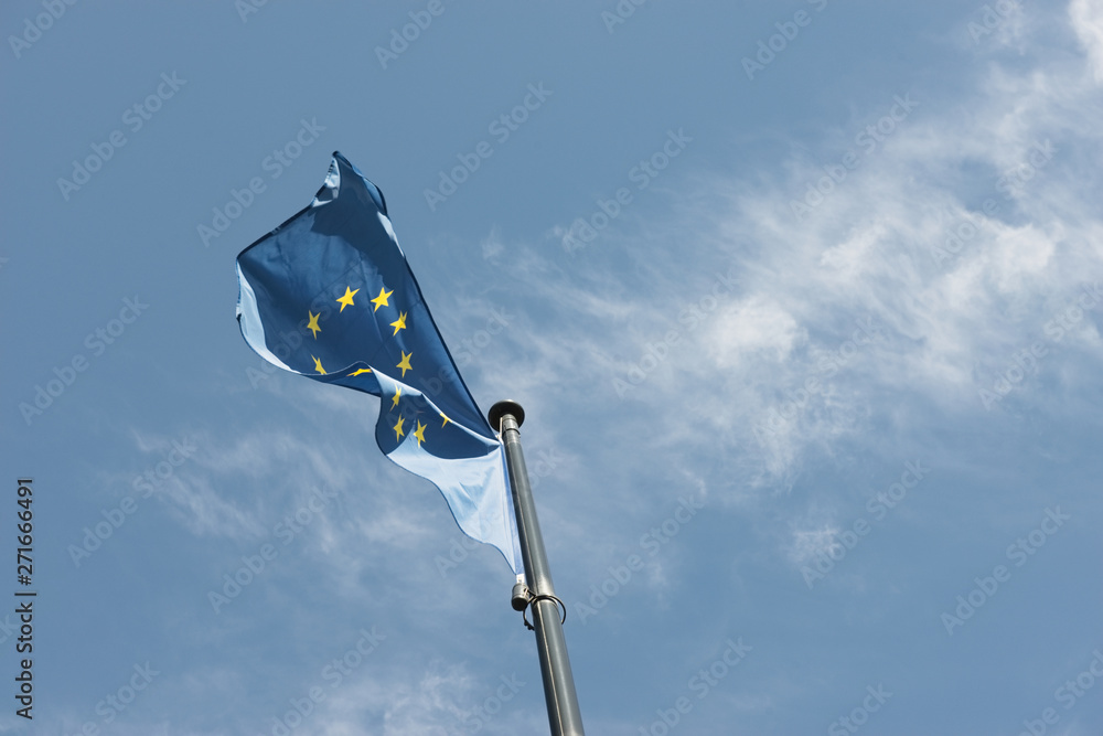 European Union flag on blue sky background