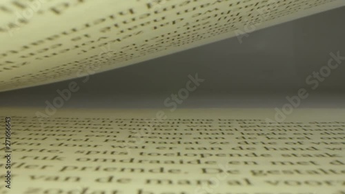 Macro pull out slow motion shot of book using the Laowa macro lens. photo