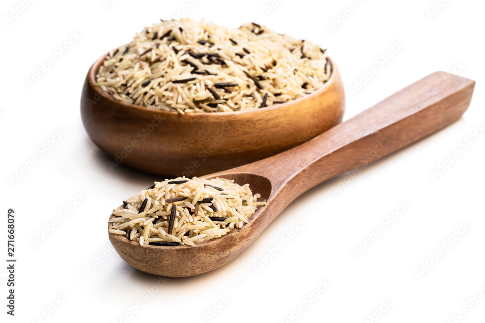 Wild brown basmati rice in a wooden bowl isolated on white Wild brown basmati rice in a wooden bowl isolated on white