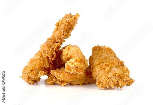Fried chicken fillets on a white background. Fried chicken nuggets close-up.