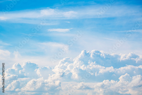 Beautiful porous clouds on a clear blue sky. Abstract background
