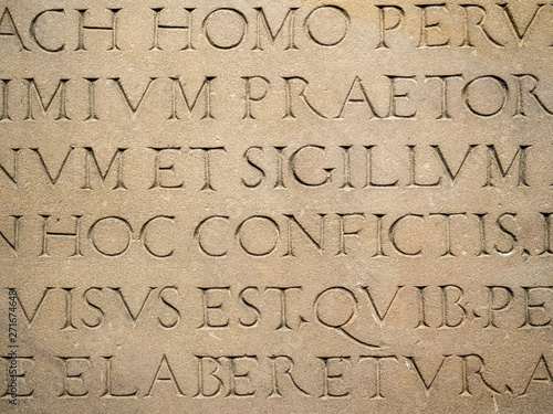Photography Old Latin text engraved on stone latin characters words