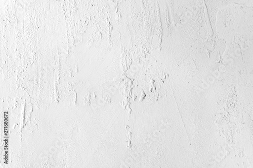Neutral white colored low contrast Concrete textured background with roughness and irregularities to your concept or product.