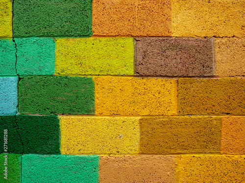 Bricks painted in yellow green color. Abstract background.