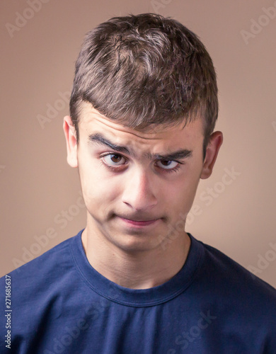 Young man with angry facial expression. Human facial expression, body language