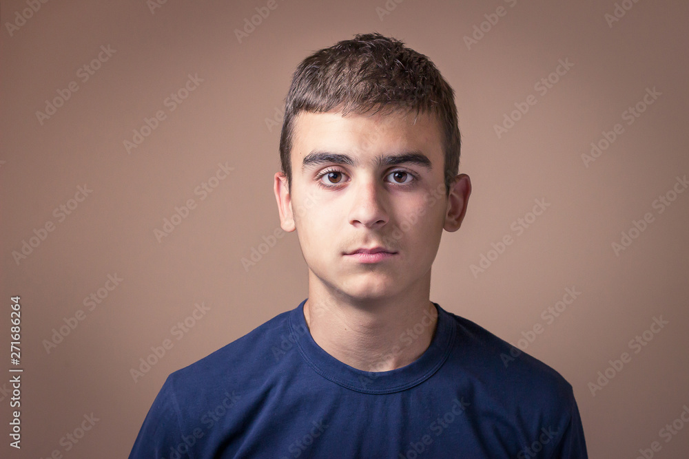 Young man with normal facial expression. Human facial expression, body language