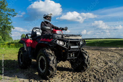 Outdoor activity. Quad bike rides. Extreme sport. Nature  forest  river.