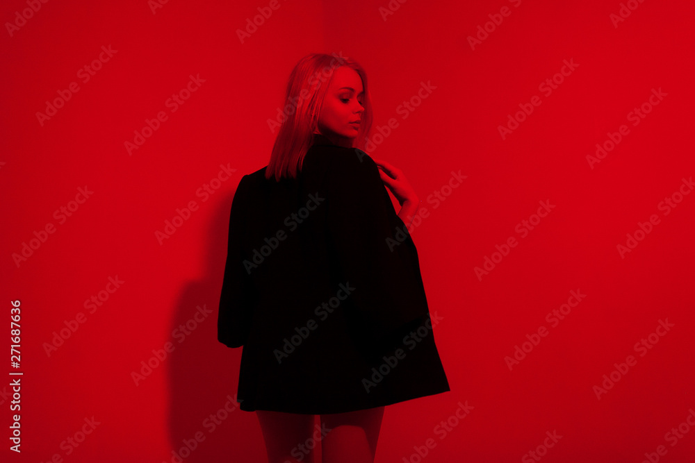 Fototapeta premium young teen girl in red blue purple light