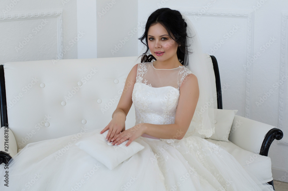 bride in white wedding dress in living room bride in white wedding dress in living room