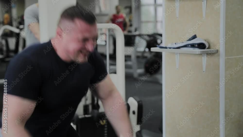 Sportsman doing heavy rope training at the gym Sportsman doing heavy rope training at the gym