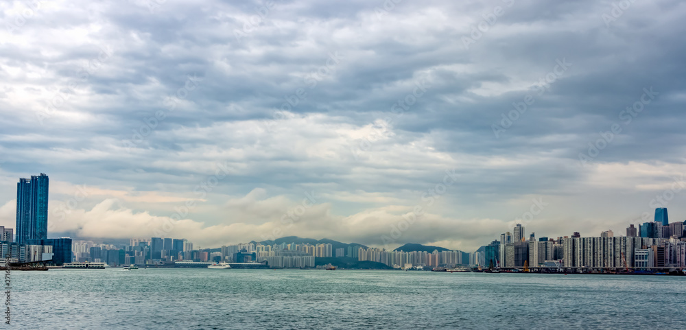 Stormy clouds over Hong Kong bay,  city scyline