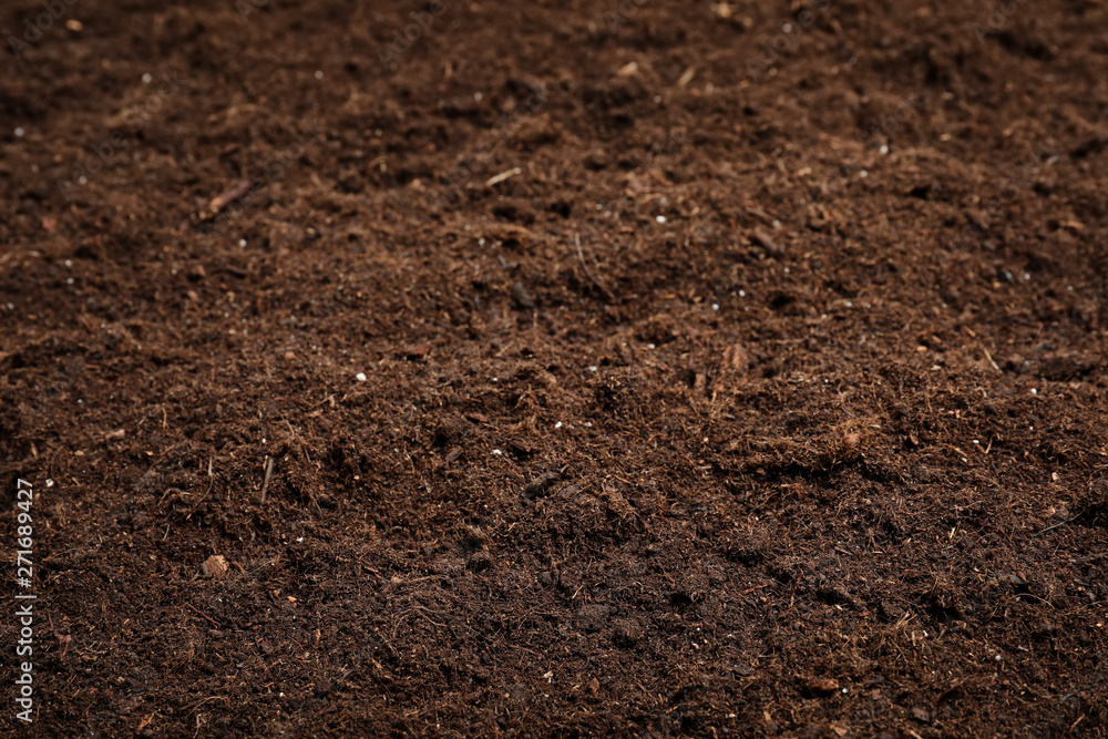Textured fertile soil as background. Gardening season Textured fertile soil as background. Gardening season