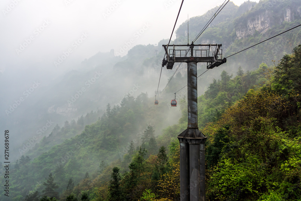 Cable way vanishing in mist or fog in Tianmen Mountain