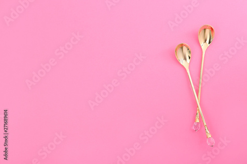 Clean tea spoons and space for text on color background, flat lay