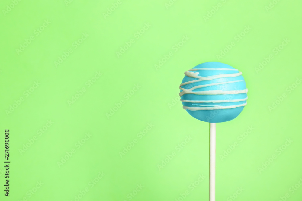Bright delicious cake pop on color background. Space for text Bright delicious cake pop on color background. Space for text