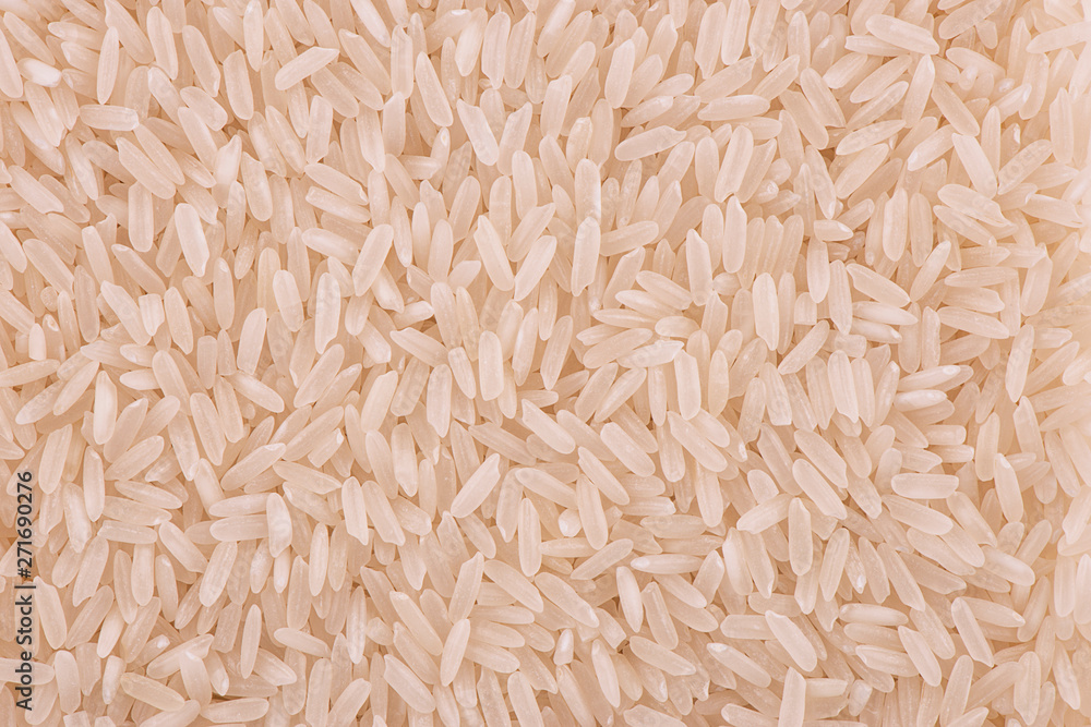 Top view on background texture of uncooked jasmine rice. Copy space for your text. Top view on background texture of uncooked jasmine rice. Copy space for your text.