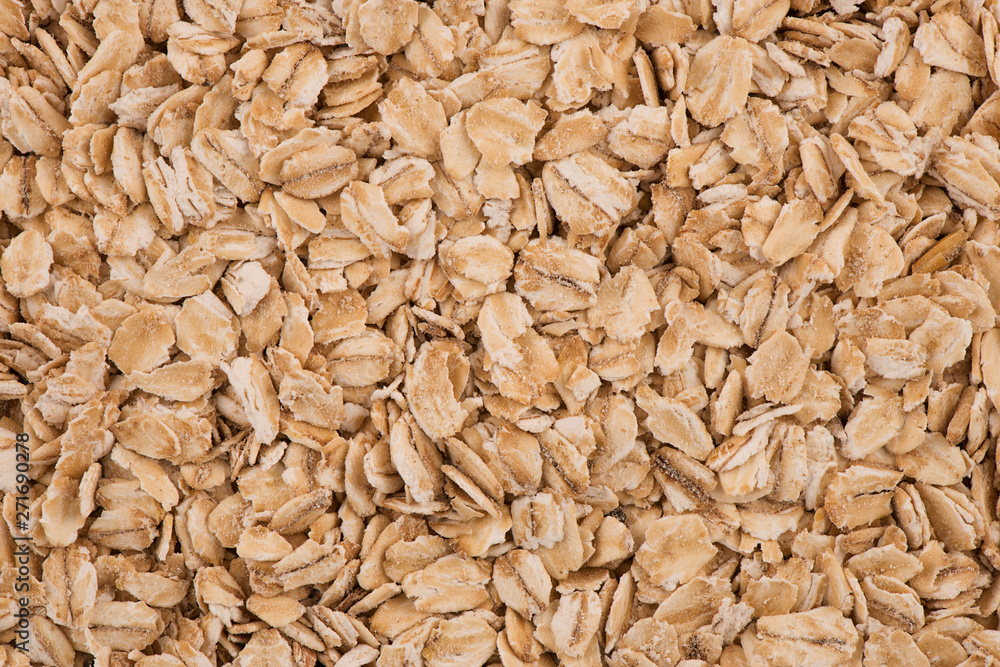 Top view on background texture of uncooked oat flakes. Copy space for your text. Top view on background texture of uncooked oat flakes. Copy space for your text.