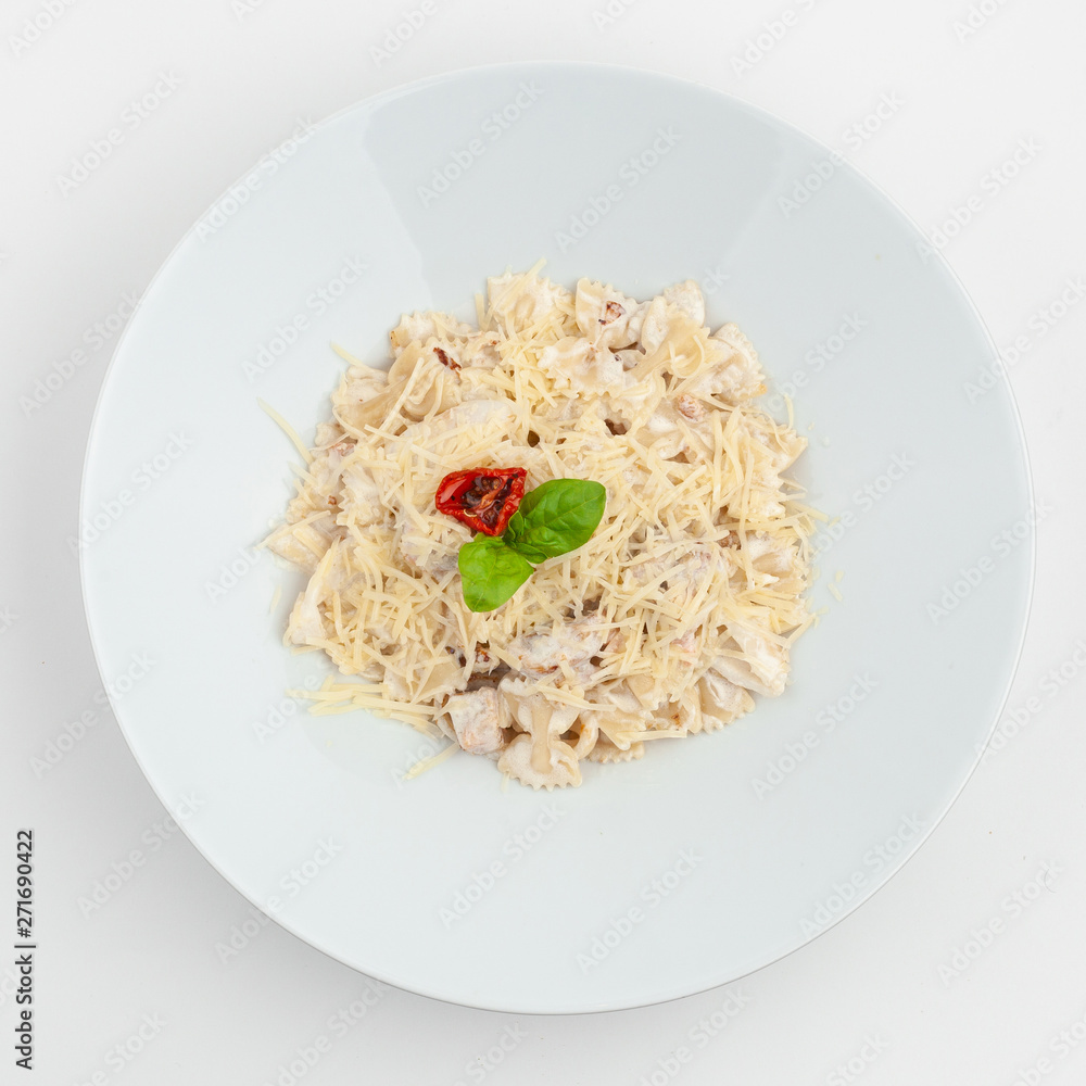 Farfalle carbonara in creamy sauce with parmesan isolated on white background Farfalle carbonara in creamy sauce with parmesan isolated on white background