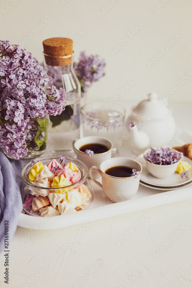 Purple spring lilac flowers breakfast still life Purple spring lilac flowers breakfast still life