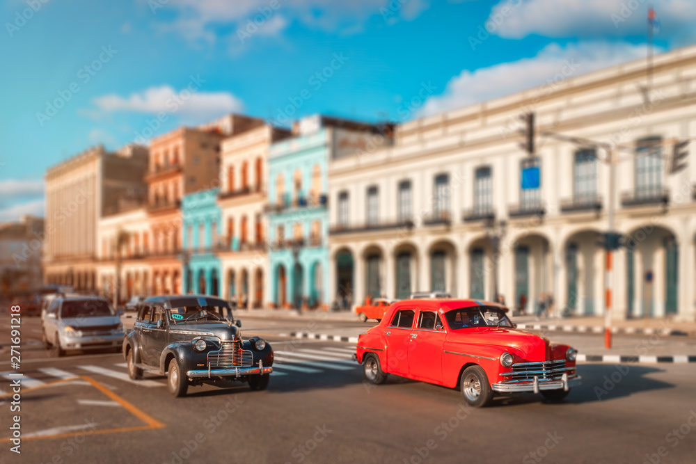 Old cars and colorful buildings in Havana
