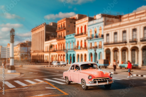 Old american car and colorful buildings in Havana