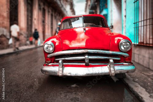 Old car on a narrow street in Old Havana © kmiragaya
