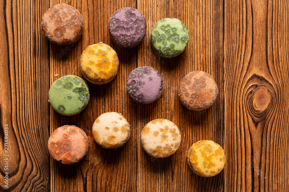 top view moldy macaroons on a wood table top view moldy macaroons on a wood table