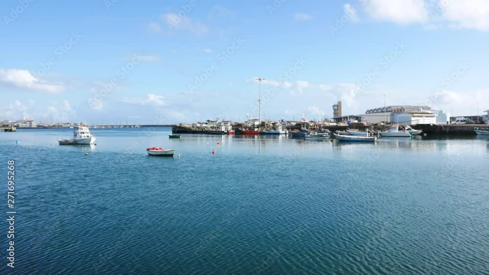 Fishing harbor in Portugal on bright sunny day. Pan right. Fishing harbor in Portugal on bright sunny day. Pan right.