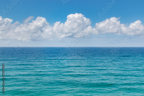 tropical ocean sea water and fluffy clouds landscape  © QuickStartProjects