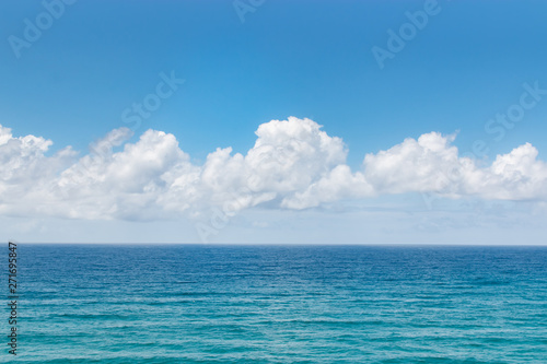 tropical ocean sea water and fluffy clouds landscape 