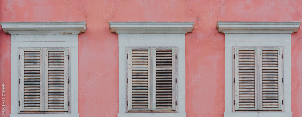 Pink wall and white windows