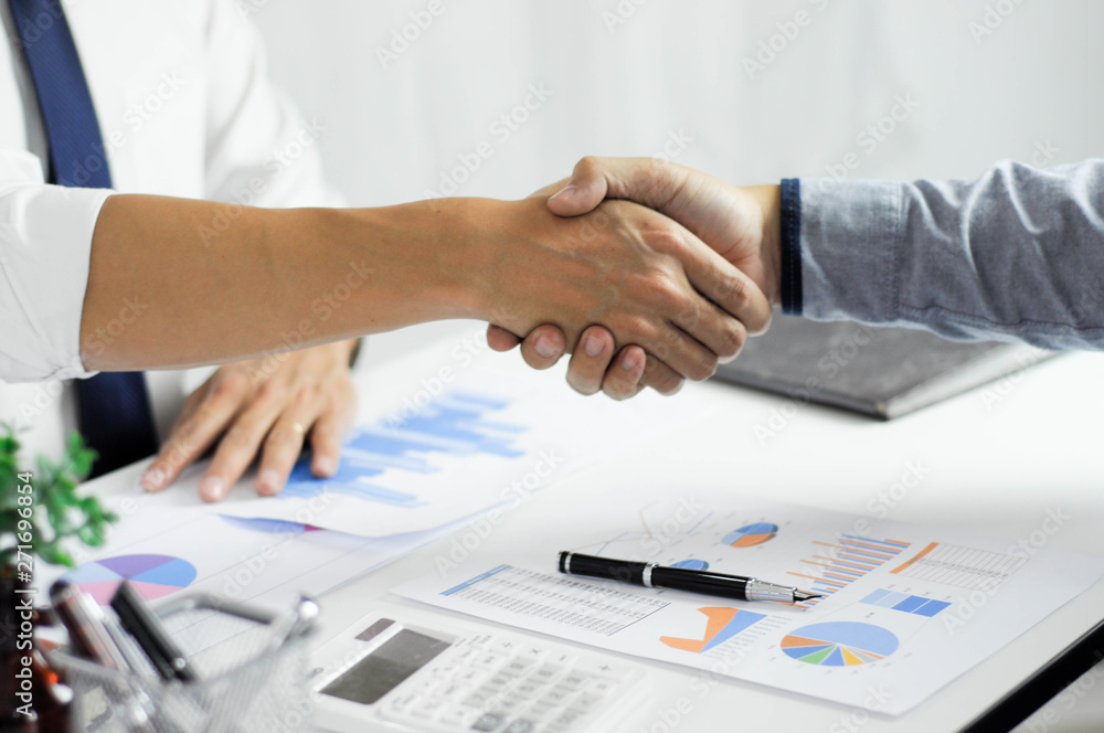 Close-up of business partners shaking hands and.hand business men and women who shaking hands Close-up of business partners shaking hands and.hand business men and women who shaking hands