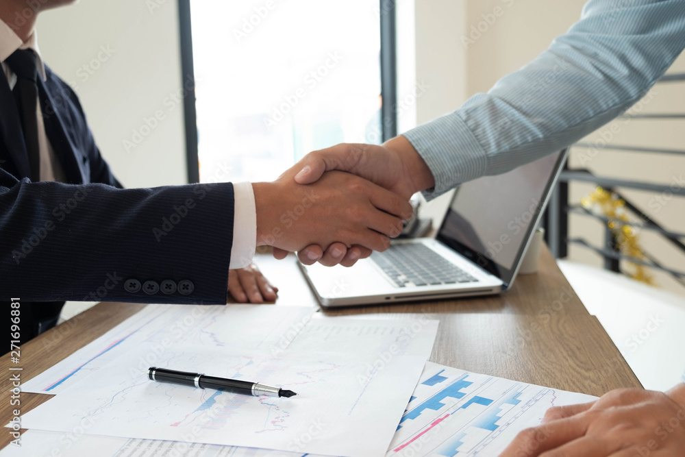 Close-up of business partners shaking hands and.hand business men and women who shaking hands Close-up of business partners shaking hands and.hand business men and women who shaking hands
