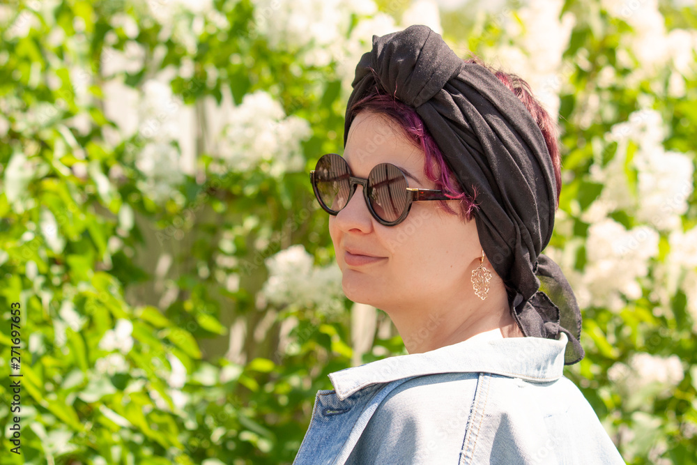 Modern girl in a scarf tied like a turban Modern girl in a scarf tied like a turban
