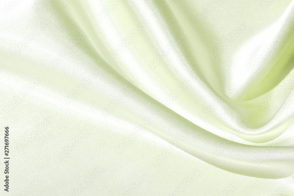 Obraz premium The texture of the satin fabric of green color for the background