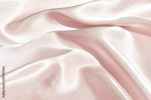 Charming smooth satin and silk pink fabric for backgrounds. Elegant abstract upholstery use for holidays 