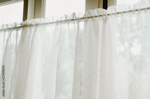white see through window curtain at home