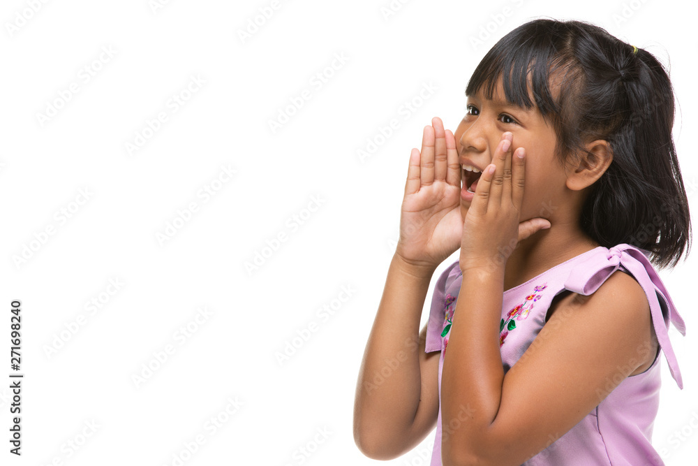 Cute asian dark little girl making a funny emotion on face . Cute asian dark little girl making a funny emotion on face .