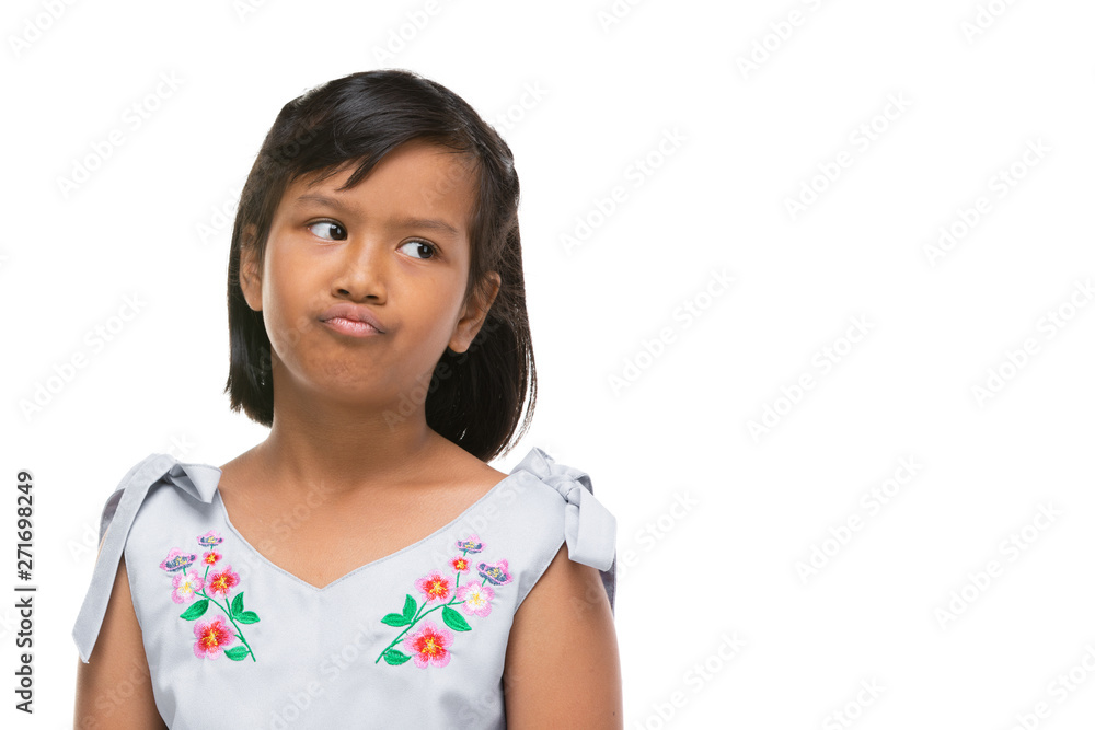 Cute asian dark little girl making a funny emotion on face . Cute asian dark little girl making a funny emotion on face .