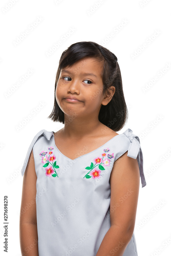 Cute asian dark little girl making a funny emotion on face . Cute asian dark little girl making a funny emotion on face .
