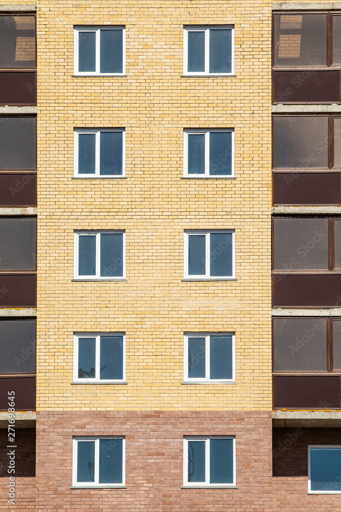 High-rise red brick house with windows, architecture. High-rise red brick house with windows, architecture.