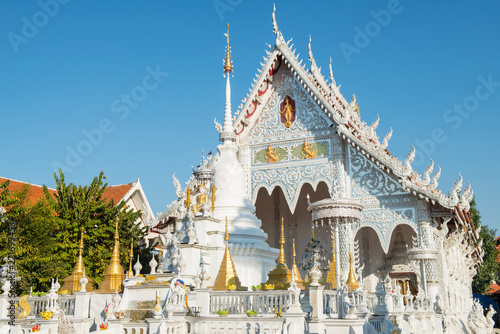 Wat Chiang Rai (or White temple) an ornate little temple with mirrored tiles located in the centre of Lampang province, Thailand.