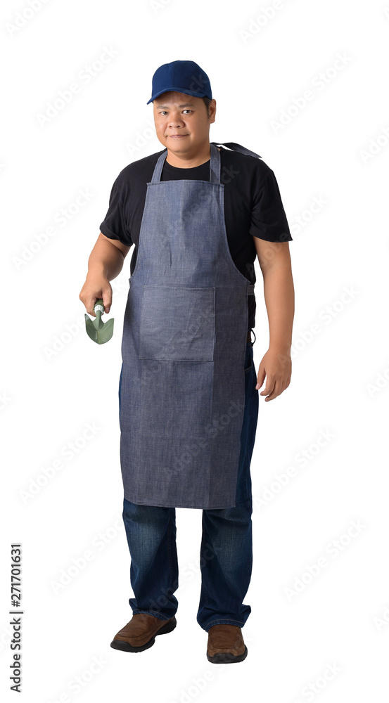 Full body portrait of a worker man or Serviceman in Black shirt and apron is holding Shovel for Cultivators isolated on white background Full body portrait of a worker man or Serviceman in Black shirt and apron is holding Shovel for Cultivators isolated on white background